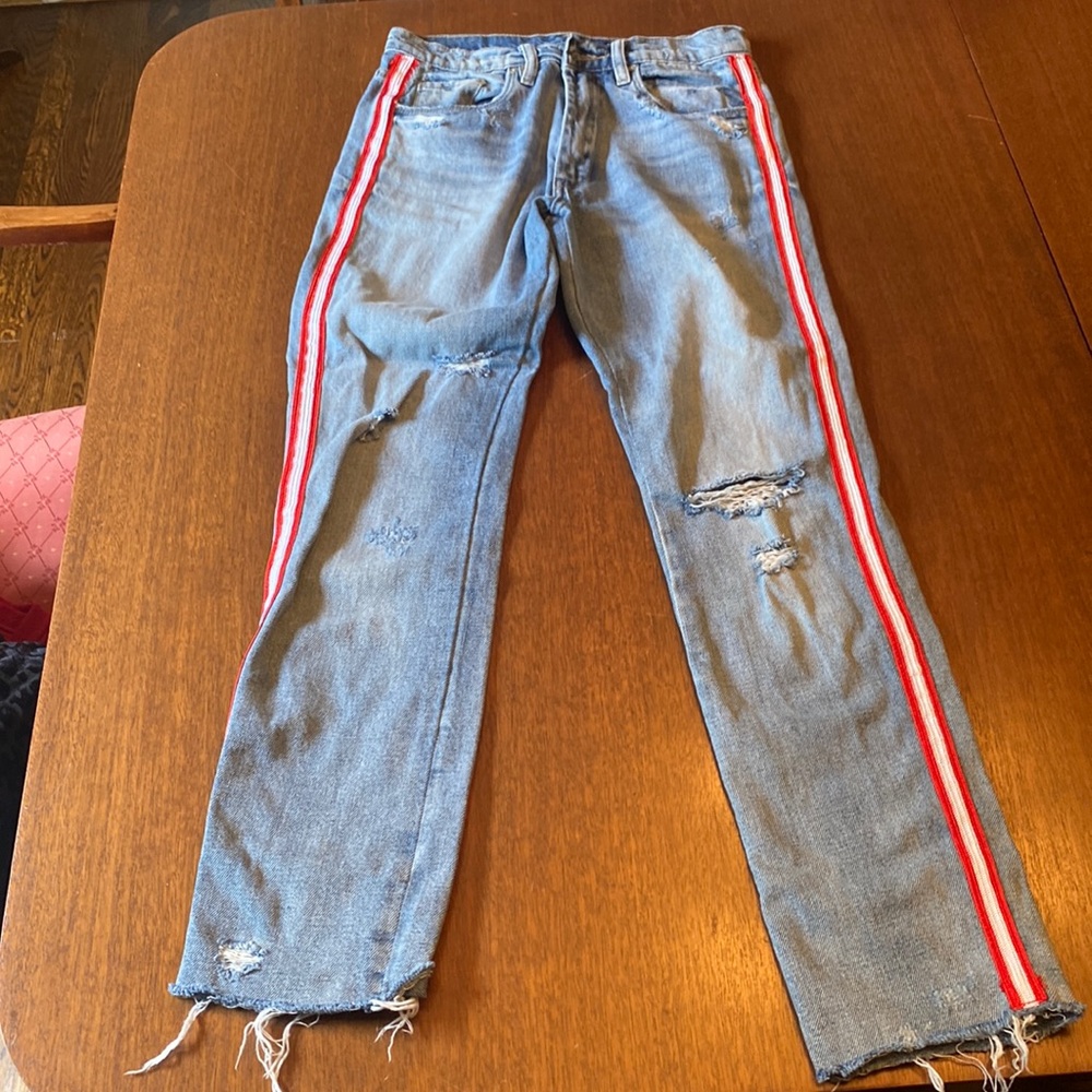 Jeans with red and white band down side